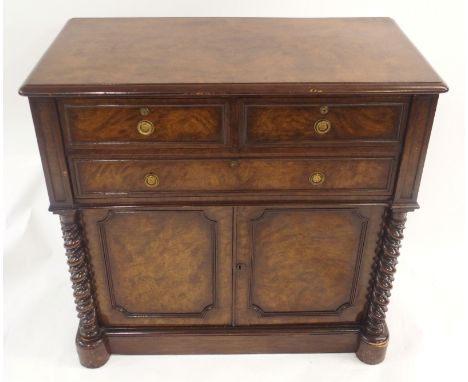 A VICTORIAN WALNUT CABINET with two short above one long drawer and in pair of panelled doors with Bramah locks and Prince of