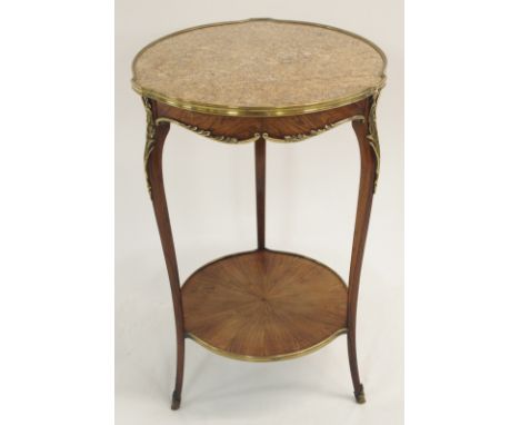 A FRENCH ROSEWOOD AND GILT METAL MOUNTED OCCASIONAL TABLE with marble top above a shaped apron on slender legs joined by a ci