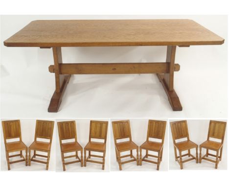 AN ALAN "ACORNMAN" GRAINGER OAK REFECTORY TABLE with adzed top on shaped supports joined by a stretcher with signature acorn,