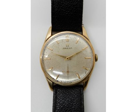 A GENTS 9CT GOLD OMEGA WATCH with cream brush textured dial gold baton numerals and subsidiary seconds dial, inner case hallm