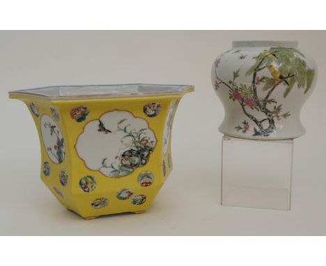 A CHINESE FAMILLE JAUNE HEXAGONAL PLANTER painted with panels of birds and foliage, amongst roundels of precious objects, bat