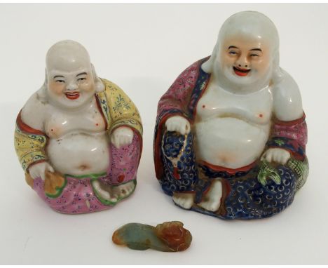 A CHINESE JADEITE BUTTON HOOK carved with a chilong head and engraved letter, 5cm long and two Canton smiling Buddhas, 11cm a