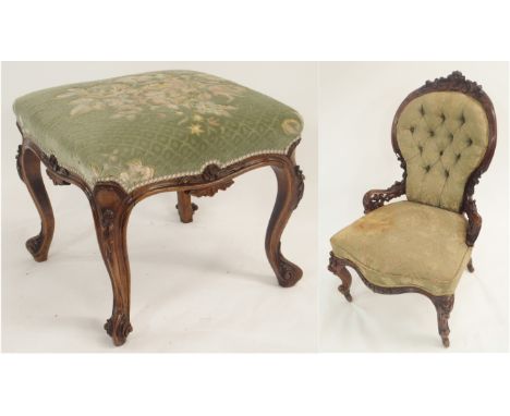 A VICTORIAN WALNUT BUTTON BACK NURSING CHAIR with foliate carved and pierced back above a serpentine shaped seat on scroll le