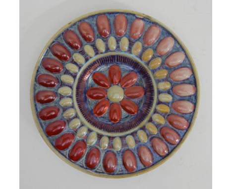 A LATE 19TH CENTURY WILLIAM DE MORGAN PLATE with gem like decoration in lustre pinks and yellow on a blue ground, painted mar