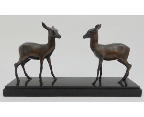 M. FONE - A SPELTER GROUP OF TWO DEER upon black slate base, 51cm long Condition Report: Available upon request