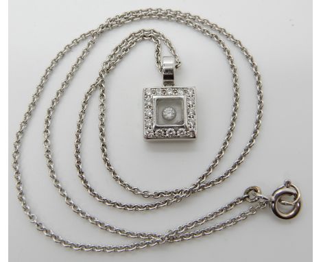 A CHOPARD HAPPY DIAMONDS SQUARE SHAPED PENDANT in 18ct white gold, length of pendant 1.6cm, length of chain 43cm, weight 8.2g