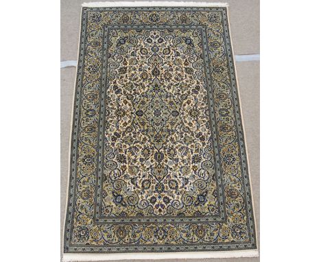 A LIGHT GROUND FINE LAMBS WOOL KESHAN with blue central medallion and borders, 218cm x 140cm Condition Report: Available upon