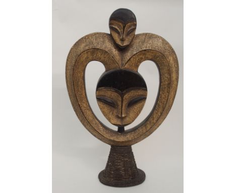 A GROUP OF AFRICAN CARVED OBJECTS comprising; a Gabon twin head carving on wicker stand, 59cm high, votive figure, 30cm high,