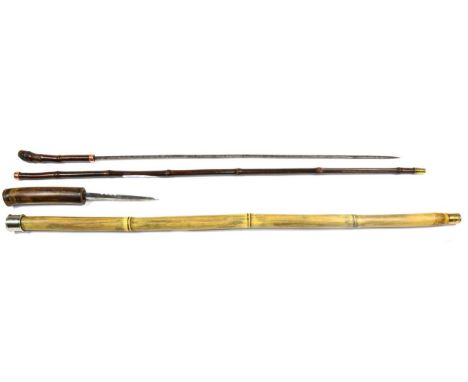 A Bamboo Dagger Stick, the 13cm double edge steel blade with two narrow fullers and scalloping at the ricasso, the haft with 