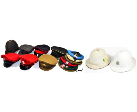 A White Tropical Helmet, of six panelled construction, with seven fold puggaree, leather bound brim, green baize lining with 