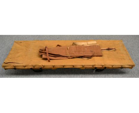 A First World War Great Western Railway Hospital Train Stretcher, the folding oak frame stamped GWR and numbered 199, the can