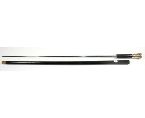 An Early 20th Century Ebonised Swordstick, with triangular section blade, the repousse-decorated white metal pommel bearing t