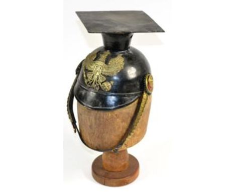 A Prussian Enlisted Man's All Steel Tschapka, black enamelled, with square top, brass helmet plate, tri-colour ear rosettes, 