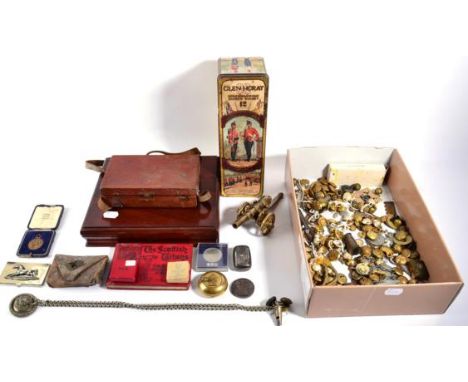 A Quantity of Militaria, including a white metal whistle, chains and lion mask for a shoulder belt, buttons, sports medals, a
