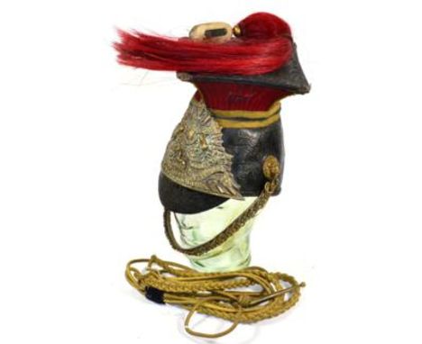 A 12th (Prince of Wales's Royal) Lancers OR's Lance Cap, with black patent leather skull, red fluted cloth sides to the black