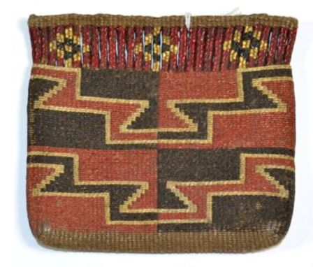 A Native North American Flat Pouch, woven in red, black and white with a geometric design below a conforming quillwork border