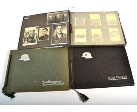 Two German Third Reich Period Photograph Albums, comprising: Album 1 - the cover relief with a white metal German army helmet