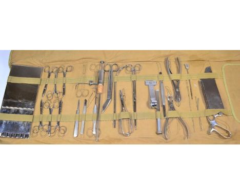 A First World War US Army Medical Corps Field Surgeon's Small Operating Case, in canvas roll, the inner flap stencilled with 