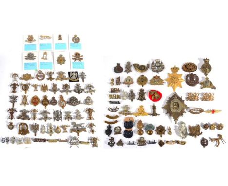 A Collection of Approximately Fifty Cap and Collar Badges, and shoulder titles, mainly cavalry regiments, in brass, white met
