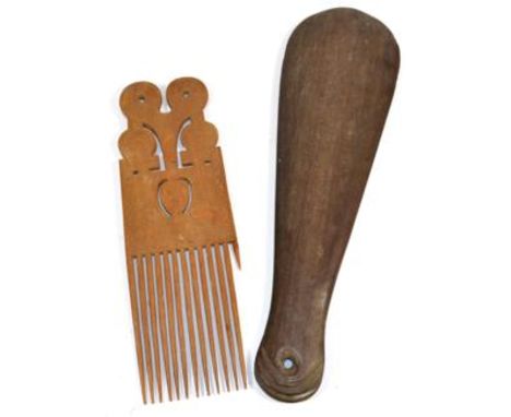 A Maori Patu, of dense hard wood, the grip with overlapping scale carved pommel, 39cm;  a Solomon Islands Hair Comb, made fro