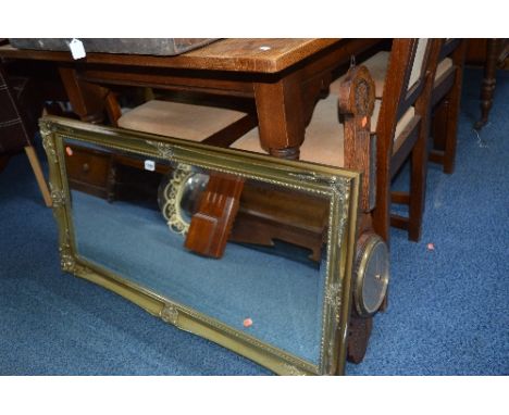 A MODERN GILT FRAMED WALL MIRROR, and an oak barometer