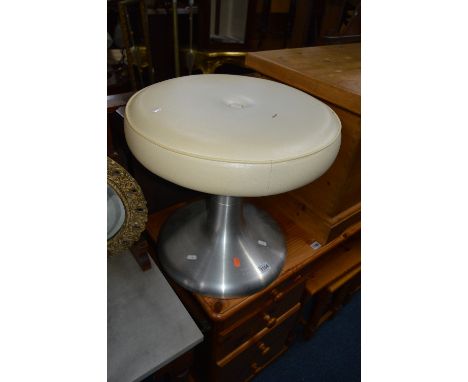 A RETRO STOOL, with a spun aluminium tulip base and a cream leatherette top with a central decoration button