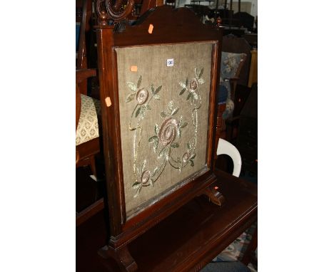 A MAHOGANY FIRESCREEN, with needlework detail (sd, losses)