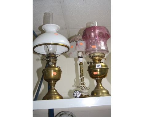 TWO BRASS OIL LAMPS, with glass shades and a table lamp (3)