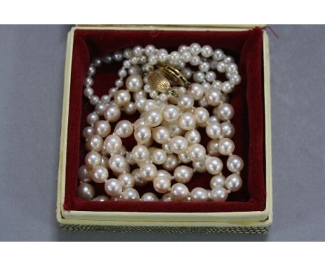TWO PEARL NECKLACES, on 9ct clasps