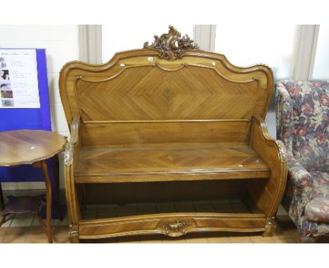 A FRENCH CARVED BENCH, with foliate detail to top (made from parts of a bed), approximate size width 157cm x height 143cm x d
