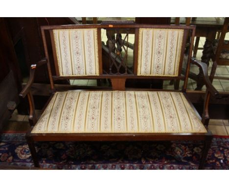 AN EDWARDIAN INLAID MAHOGANY SOFA, with striped floral upholstery