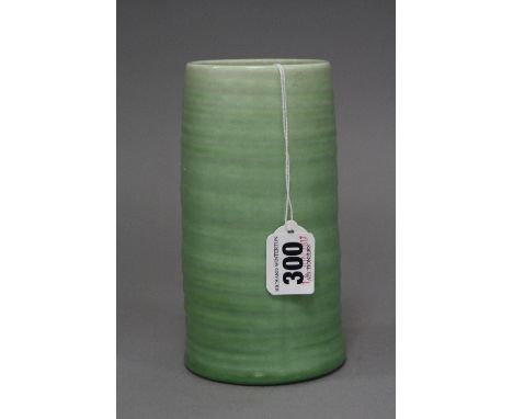 CLARICE CLIFF FOR WILKINSON LTD, a green ribbed cylindrical vase, height approximately 16cm