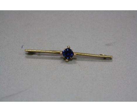 AN EARLY 20TH CENTURY SYNTHETIC SAPPHIRE AND SEED PEARL BAR BROOCH, measuring approximately 62mm in length, stamped '15c', ap