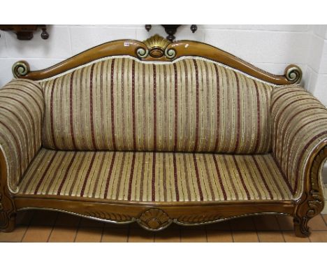 A LARGE MODERN THREE SEATER SOFA, scroll end arms and carved foliate detail (no cushion)