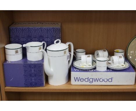 A BOXED WEDGWOOD COFFEE SET, House of Commons pattern, to include coffee pot, cream jug, sugar bowl and six coffee cans and s