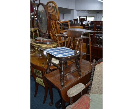 A DISTRESSED VICTORIAN WALNUT SWING MIRROR, a mahogany gate leg table and an oak smokers armchair (3)