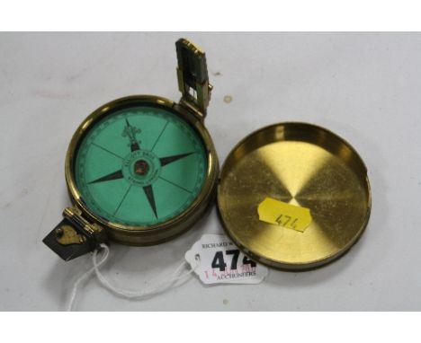 LATE 19TH CENTURY ELLIOTT BROS LONDON BRASS POCKET COMPASS, with engraved name to case 'Charles H.C. Halkess'
