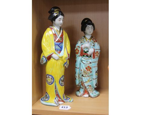 TWO LARGE GLAZED 20TH CENTURY CERAMIC FIGURES OF JAPANESE GEISHA GIRLS, both wearing elaborate robes, height of tallest appro