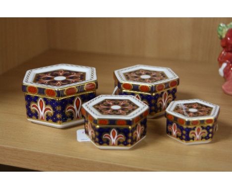 FOUR GRADUATING ROYAL CROWN DERBY HEXAGONAL TRINKET BOXES, A1297, (one re-glued)
