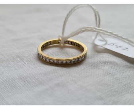 A diamond eternity ring (1 stone missing ) in 18ct gold - size N 