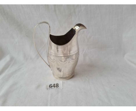 A George III Exeter silver helmet shaped cream jug with bright cut engraving 4 1/4 inches high by R Ferris circa 1805 