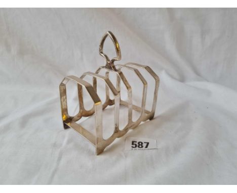 A five bar toast rack on bracket feet 4 inches Sheffield 1932 112 gms 