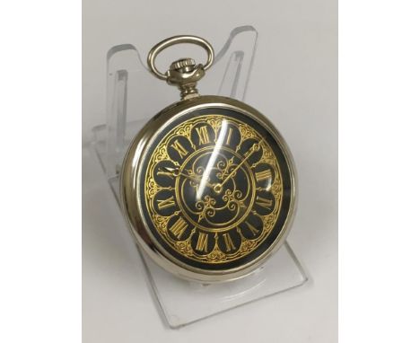 A vintage pocket watch with unusual back case design - working 