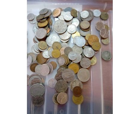 A bag of foreign coins, some silver 850 gm