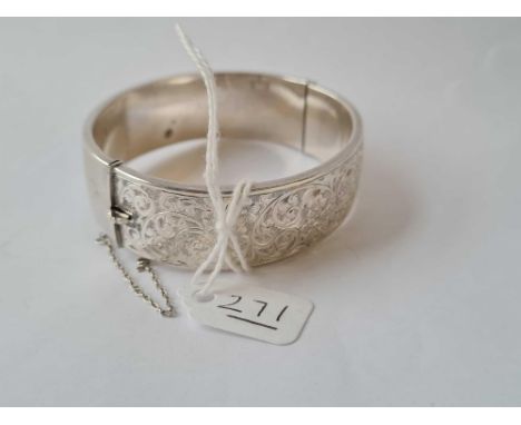 A wide silver bangle - 27gms