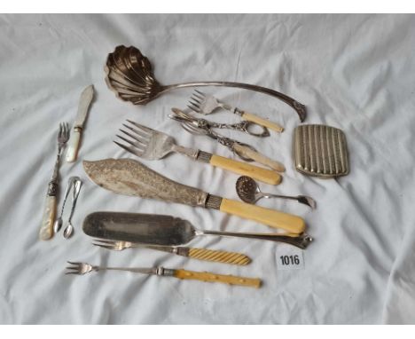 A soup ladle butter knives etc. 