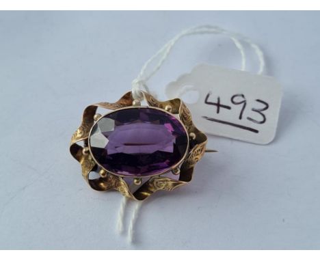 A Victorian amethyst brooch set in gold 