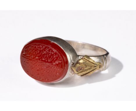 **NO RESERVE**An Islamic Agate Silver Ring with Calligraphic Inscription.This Islamic agate ring set in silver, featuring fin
