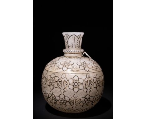 A Mughal-Style Indian Jade Carved Hookah Base with Floral Carvings.The design features elegant flowers and stems; the base ha