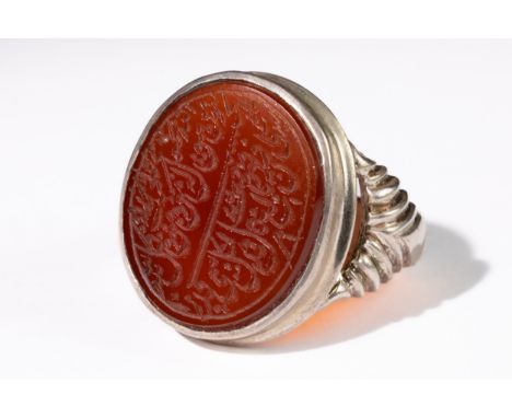 **NO RESERVE**An Islamic Agate Silver Ring with Calligraphic Inscription. ring features a deep red agate gemstone, skilfully 